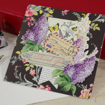 A handcrafted Thank You card with a vintage postcard design, purple hydrangea illustrations, butterflies, and a 'Thank You' ribbon banner.
