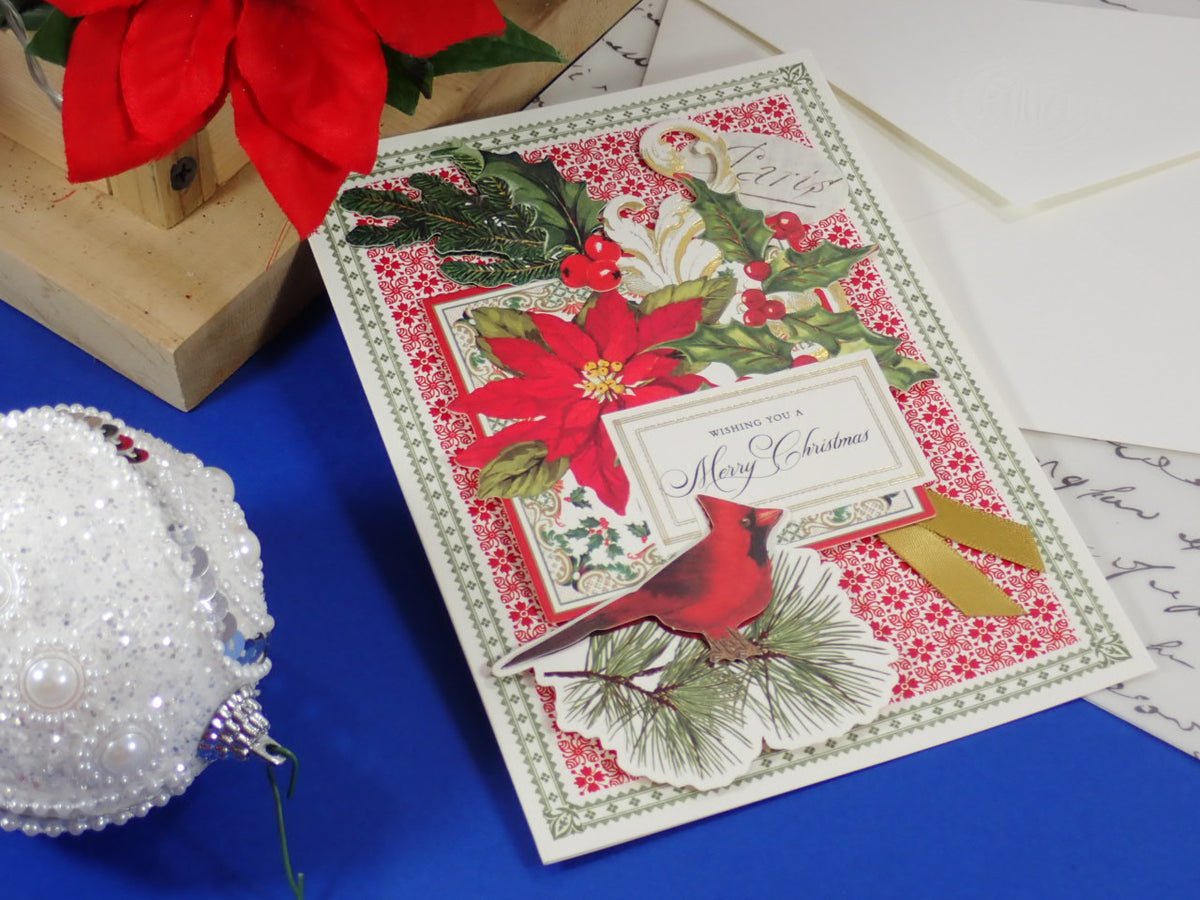 A handcrafted Christmas greeting card that says 