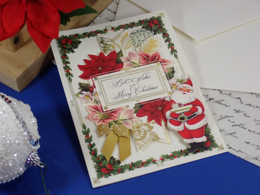 A handcrafted, Christmas Greeting Card with Santa bringing Gifts.