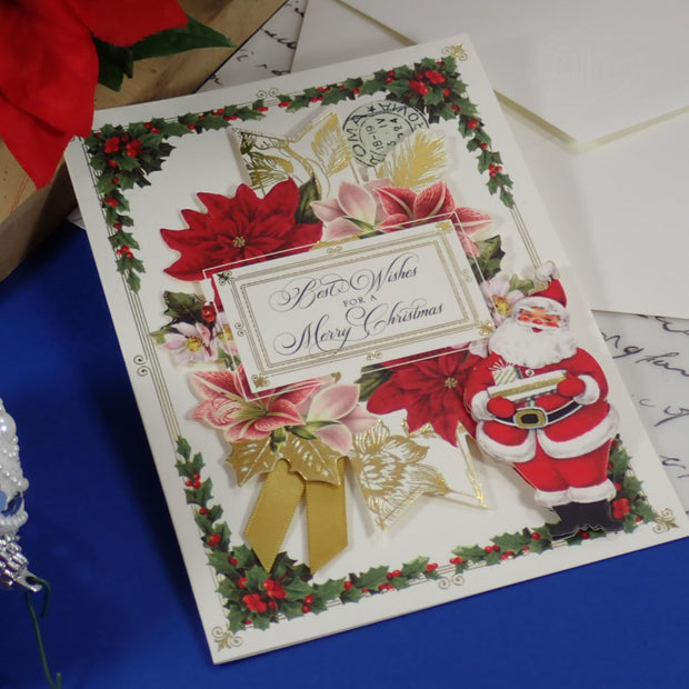 A handcrafted, Christmas Greeting Card with Santa bringing Gifts.