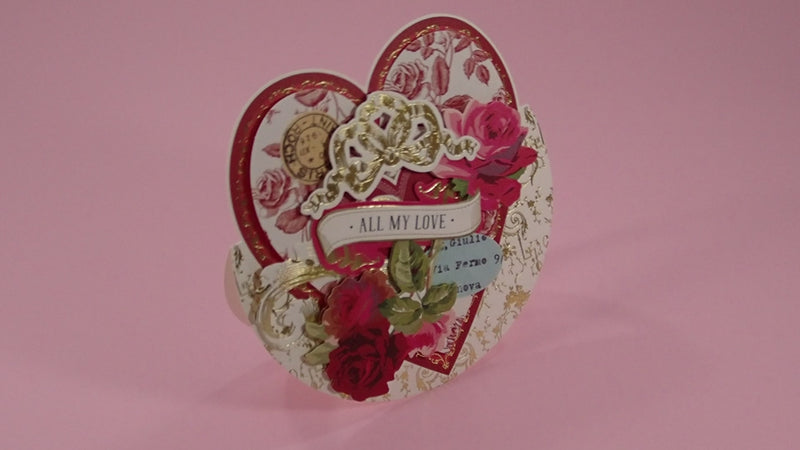 A handcrafted Valentine's Day card with richly coloured, layered, collage design.