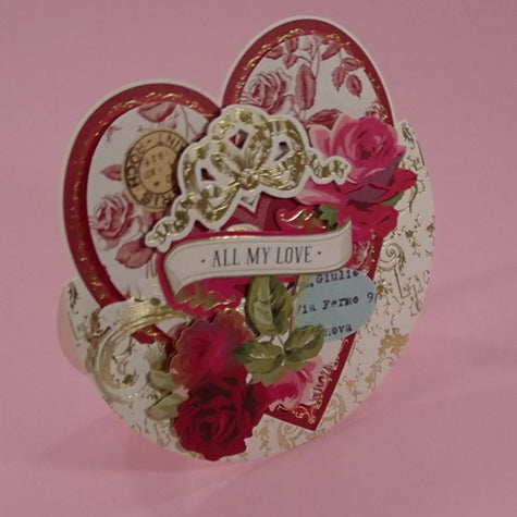 A handcrafted Valentine's Day card with richly coloured, layered, collage design.