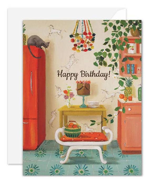 A vintage-style illustrated artisan made, birthday greeting card with a white envelope behind it. The card shows a retro kitchen scene with a red refrigerator, green leafy vines, a small bench with an orange cushion, a cake stand, and the words 'Happy Birthday!' in script.